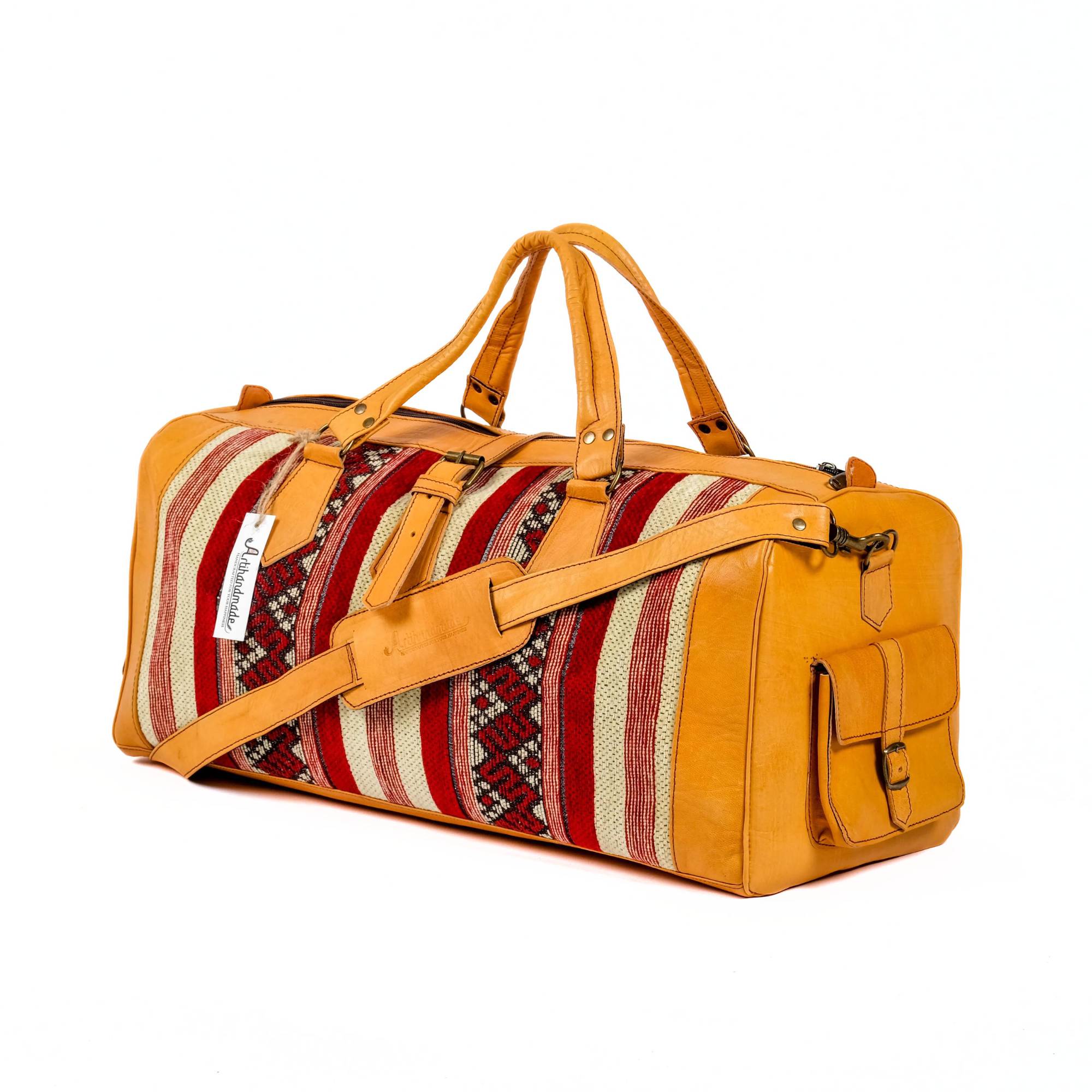A handcrafted leather kilim travel duffel bag in mustard color with a traditional design and a shoulder strap.