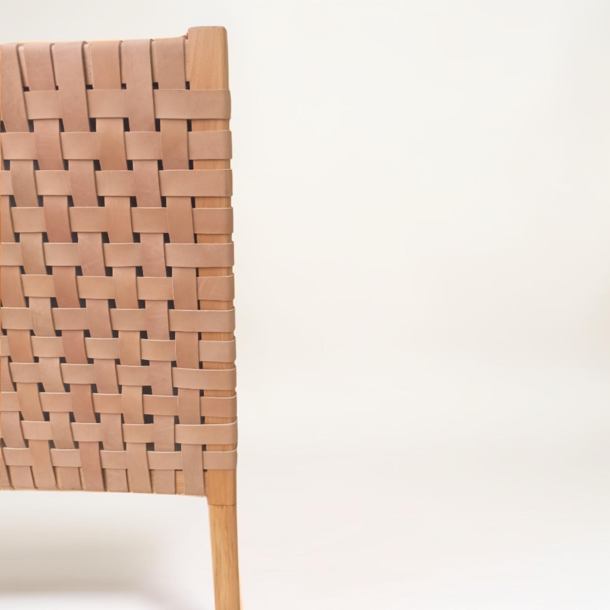 Close-up shot of the leather straps on a king headboard detailing the intricate weaving.