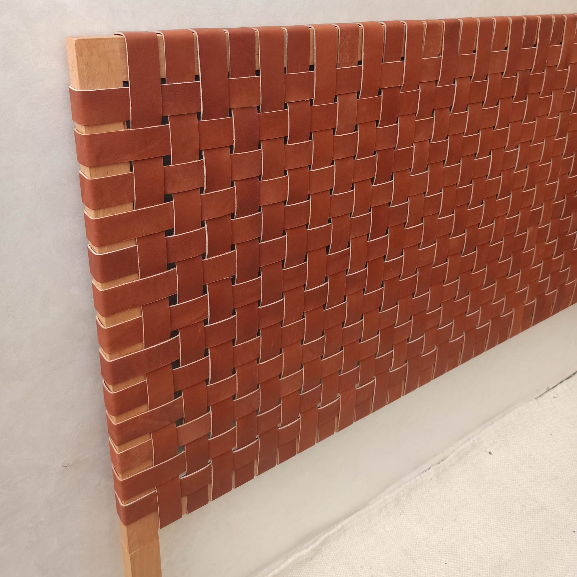 Handcrafted leather headboard, a timeless addition to any bedroom.