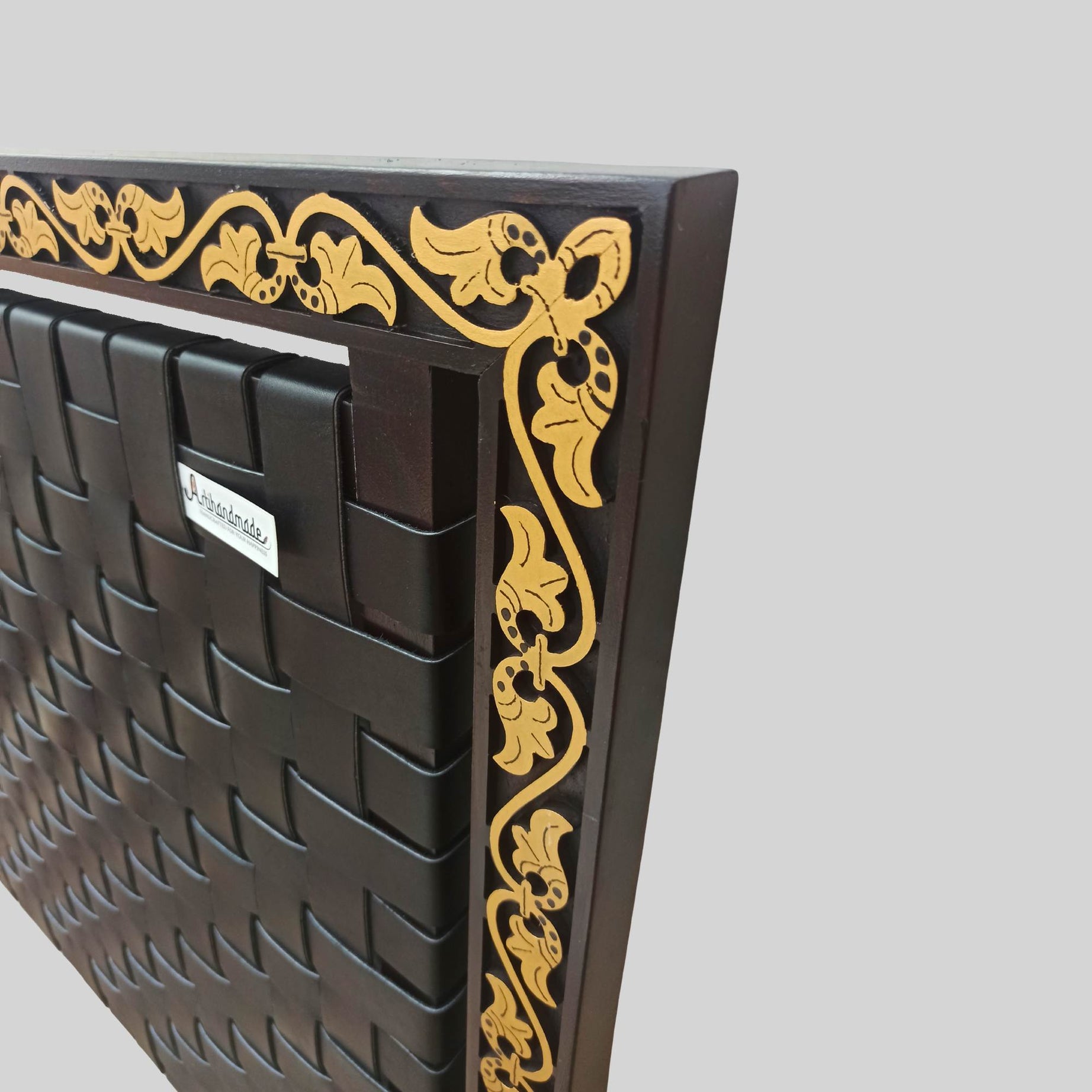 Leather headboard shown with neutral bedding and soft lighting