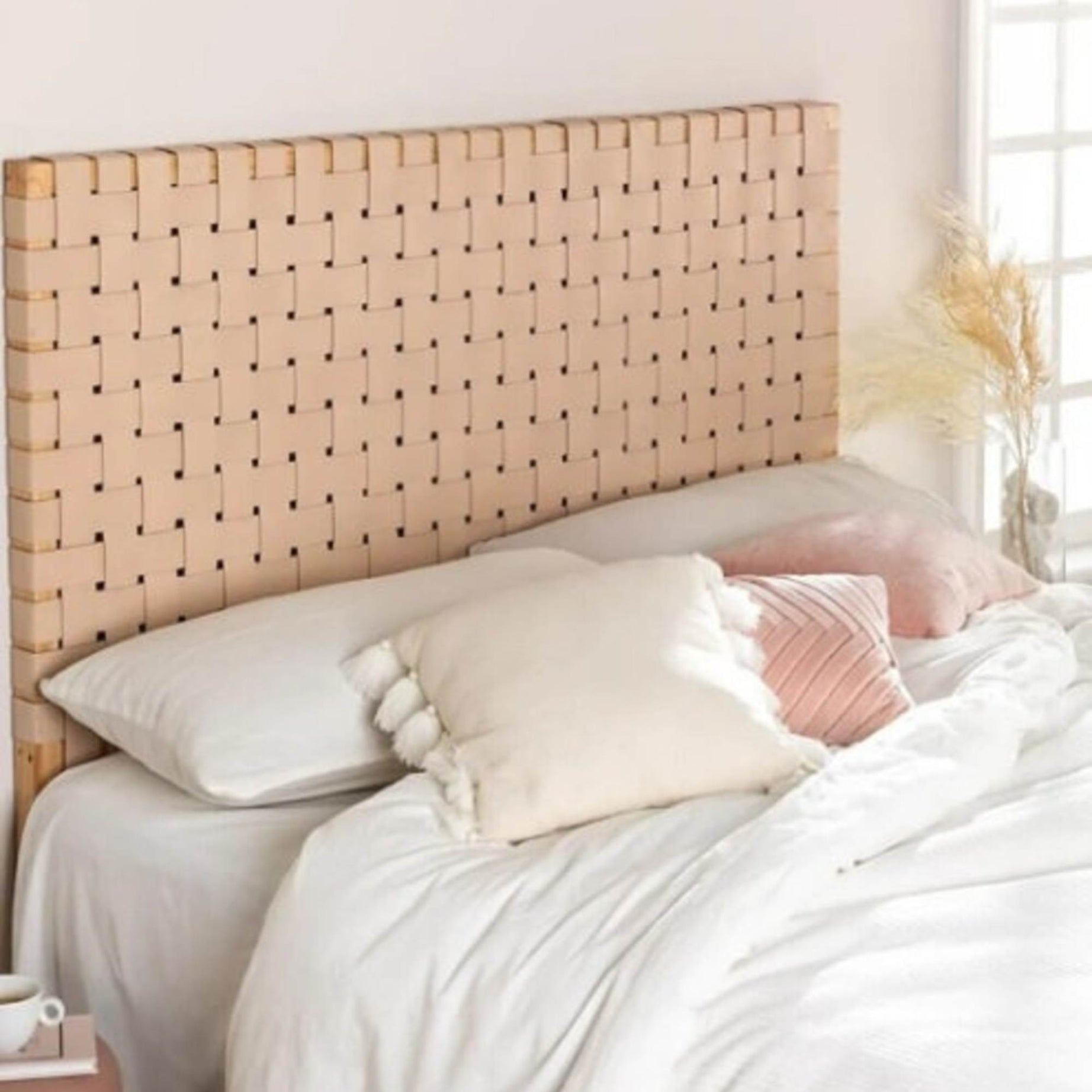 Side angle showing leather strap detail and carved wood frame