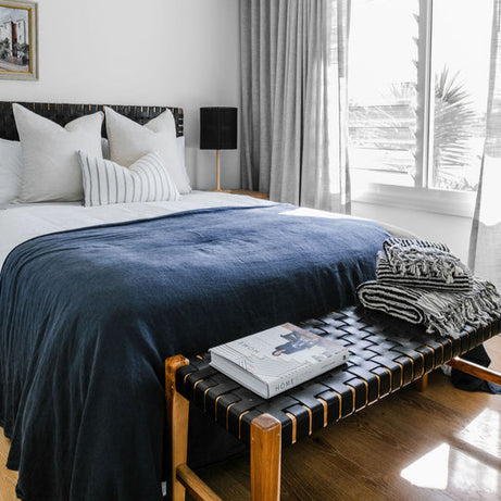 Side profile of a classic strap woven leather headboard highlighting its depth and craftsmanship