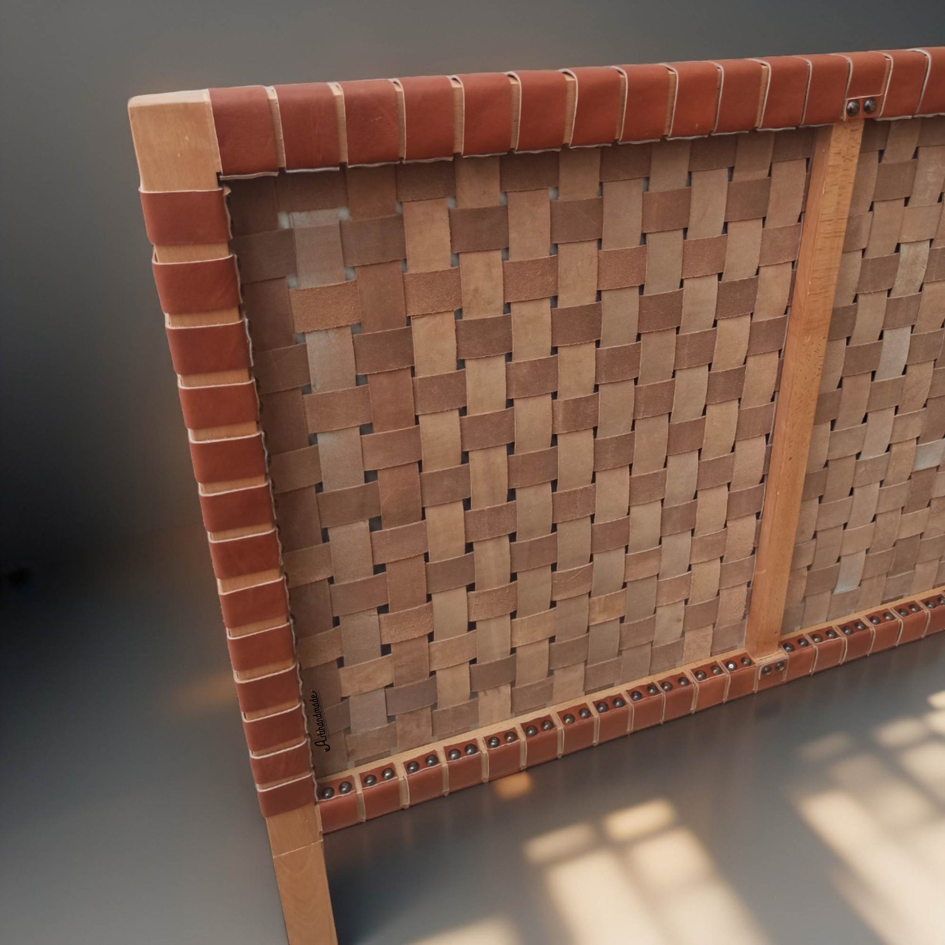 Luxurious leather headboard enhancing a serene bedroom sanctuary.