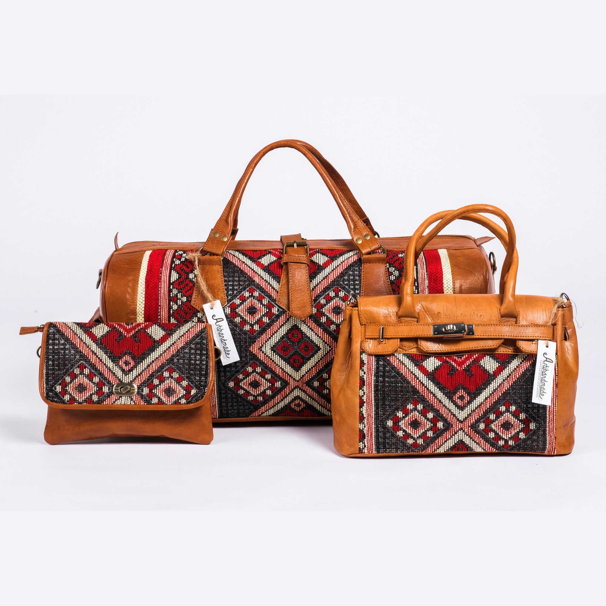 A set of three leather kilim travel bags in brown color with geometric patterns.